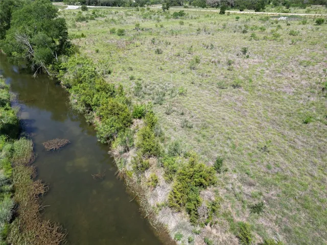 a view of a lake with a yard