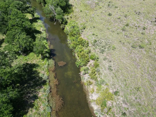 a view of a lake with a yard
