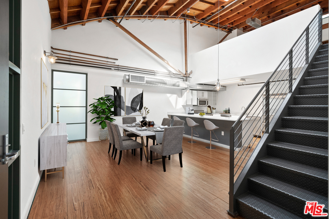 1046 Princeton Drive, Unit 210 Venice, CA 90292 - Photo 2 of 37 a view of a dining room with furniture window and wooden floor