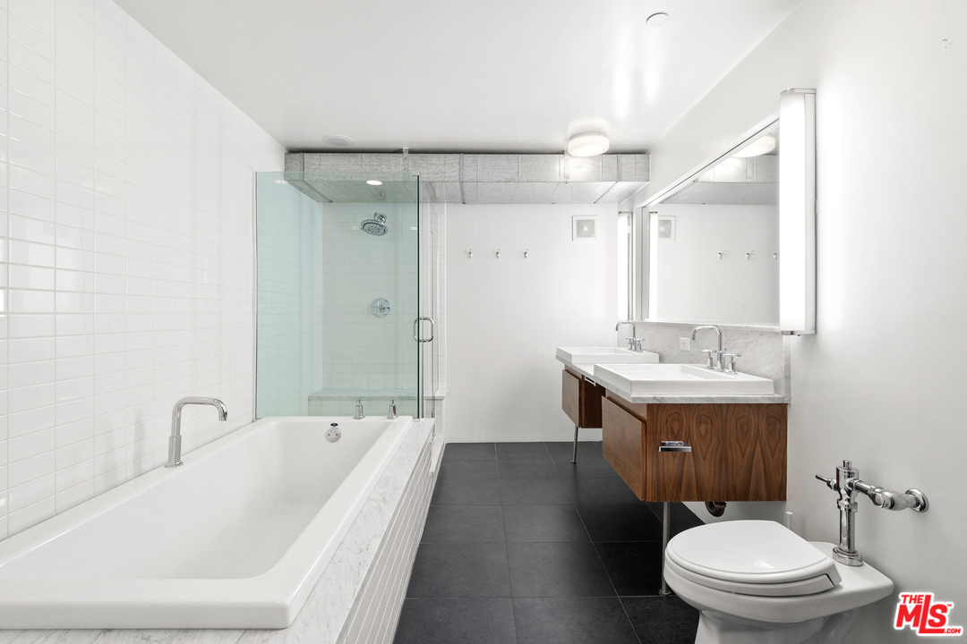 1046 Princeton Drive, Unit 210 Venice, CA 90292 - Photo 13 of 37 a bathroom with a sink a toilet and shower