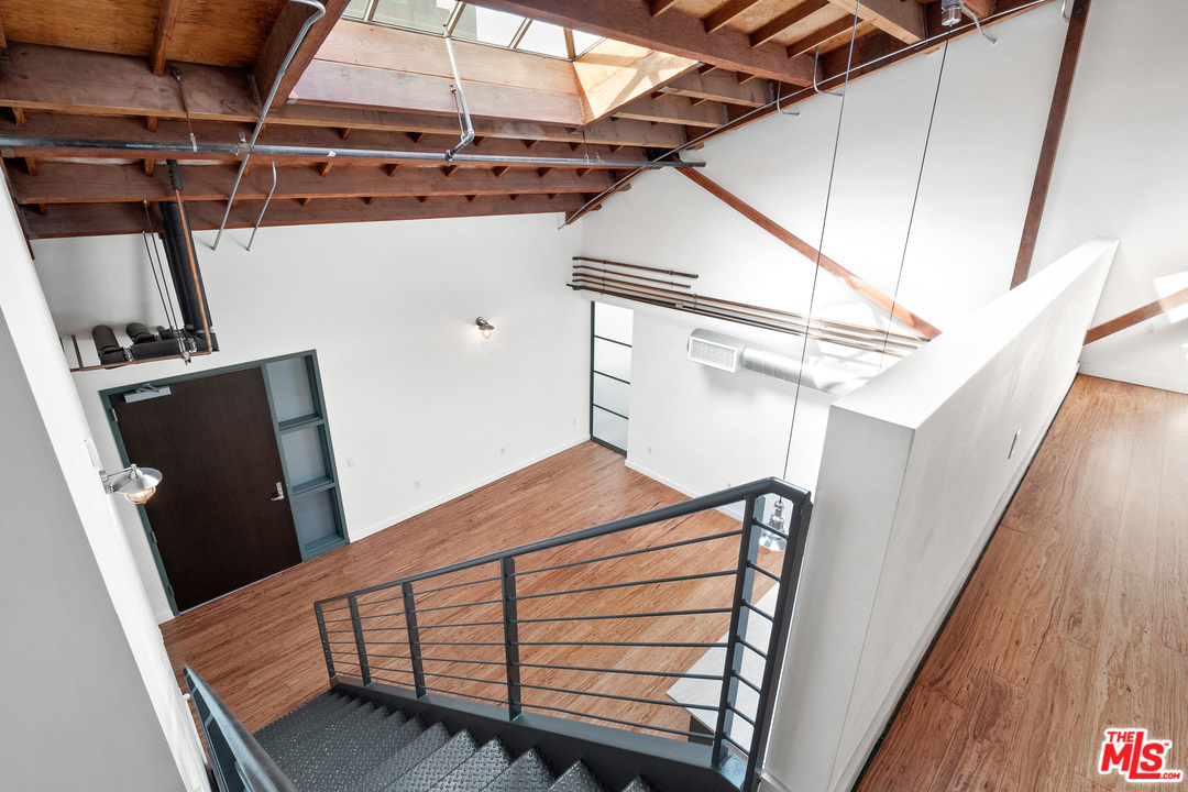 1046 Princeton Drive, Unit 210 Venice, CA 90292 - Photo 18 of 37 a view of a balcony with wooden floor
