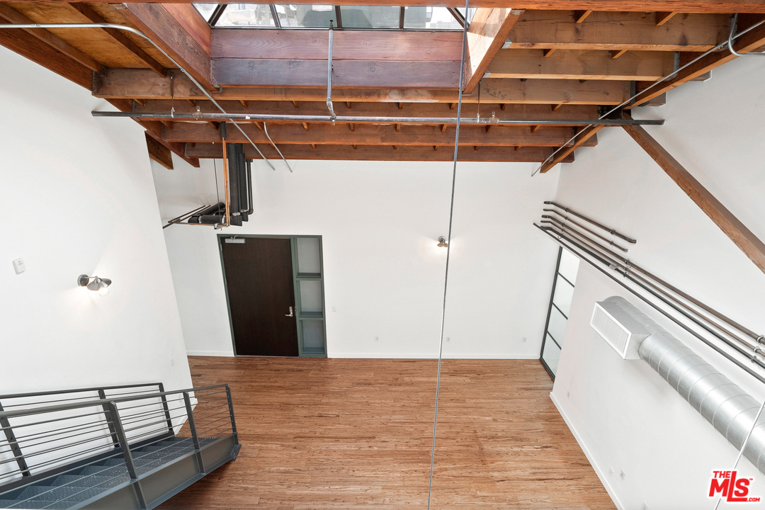 1046 Princeton Drive, Unit 210 Venice, CA 90292 - Photo 22 of 37 a view of a room with wooden floor