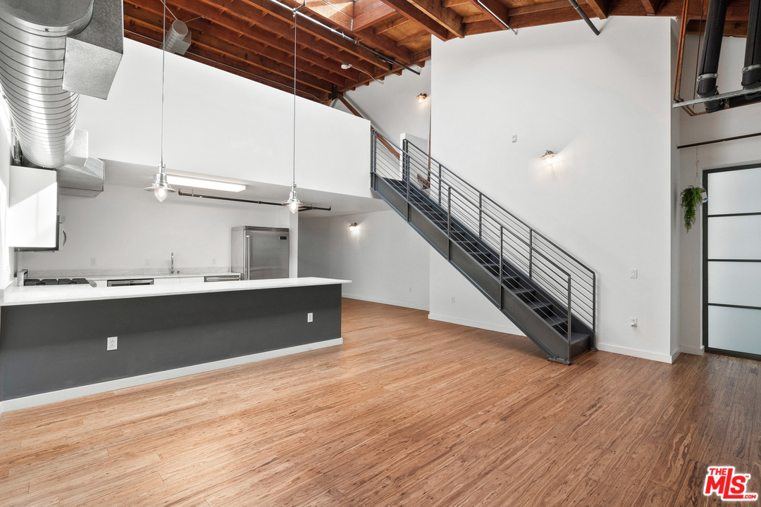 1046 Princeton Drive, Unit 210 Venice, CA 90292 - Photo 5 of 37 a view of entryway and hall with wooden floor