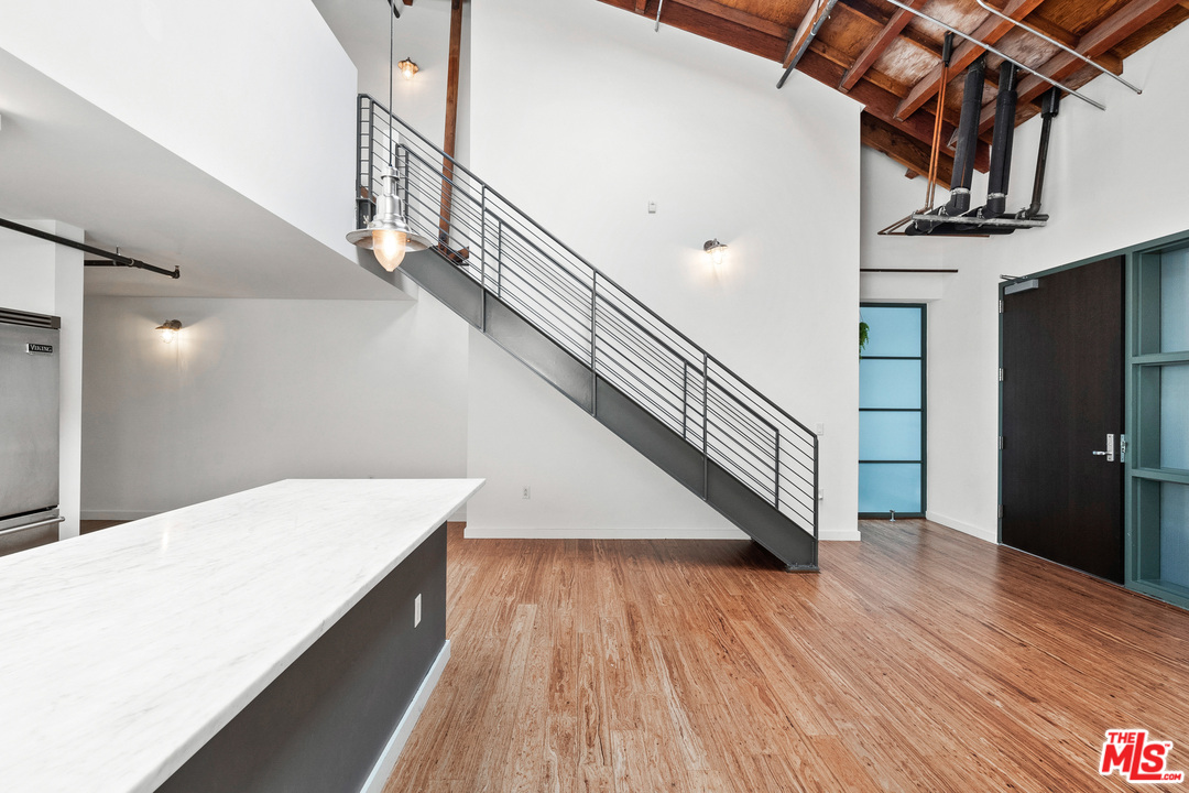 1046 Princeton Drive, Unit 210 Venice, CA 90292 - Photo 6 of 37 a view of entryway and hall with wooden floor
