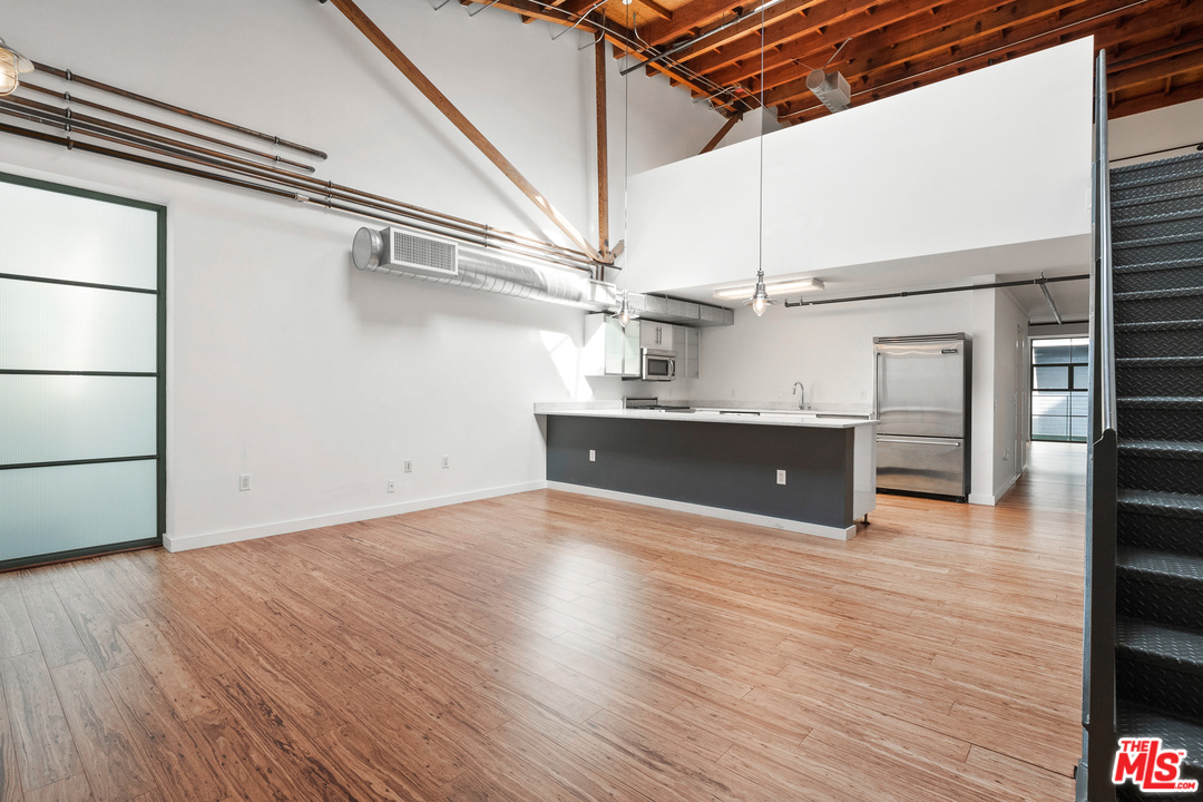 1046 Princeton Drive, Unit 210 Venice, CA 90292 - Photo 7 of 37 a view of a room with wooden floor
