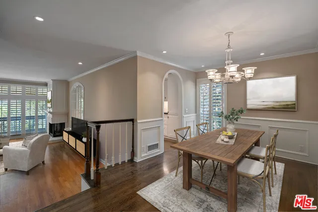 a view of a livingroom with hardwood floor and a ceiling fan