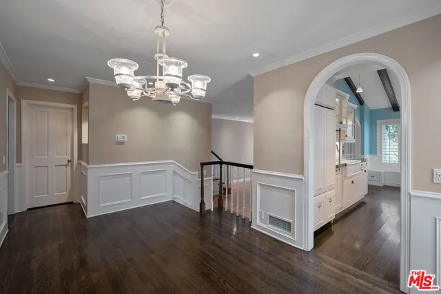 a kitchen with stainless steel appliances a sink stove and cabinets