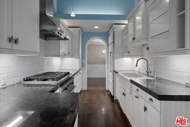 a view of staircase with white walls and a window