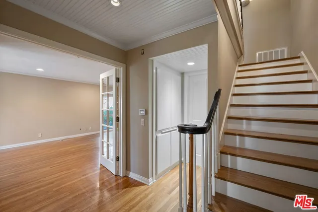 a view of empty room with windows and entryway