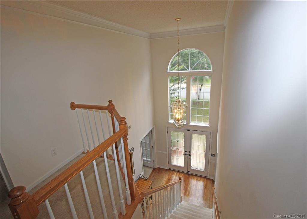 7300 Reedy Creek Road, Unit 59 Charlotte, NC 28215 - Photo 16 of 24 a view of a hallway with wooden floor and entryway
