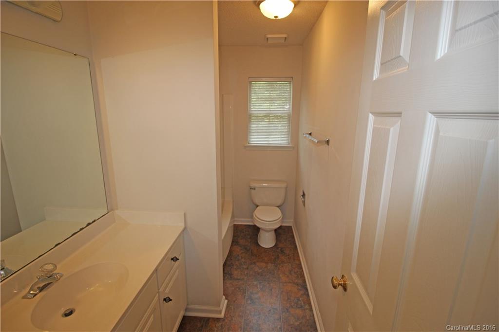 7300 Reedy Creek Road, Unit 59 Charlotte, NC 28215 - Photo 24 of 24 a bathroom with a sink and a toilet