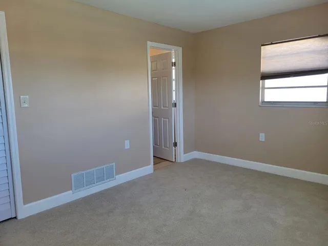 an empty room with cabinet
