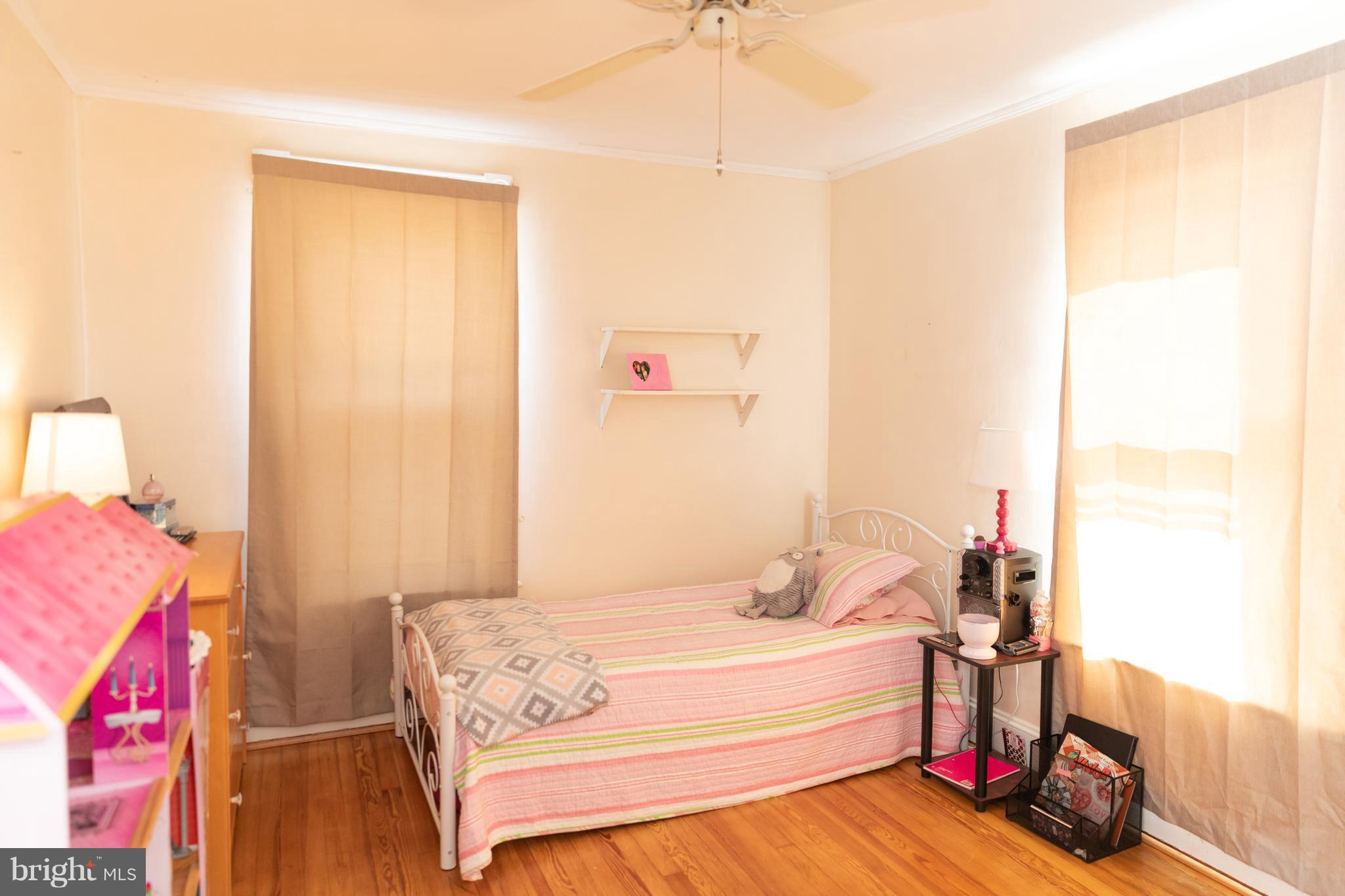 302 South Hammonds Ferry Road Linthicum Heights, MD 21090 - Photo 17 of 29 a bedroom with a bed and a dresser