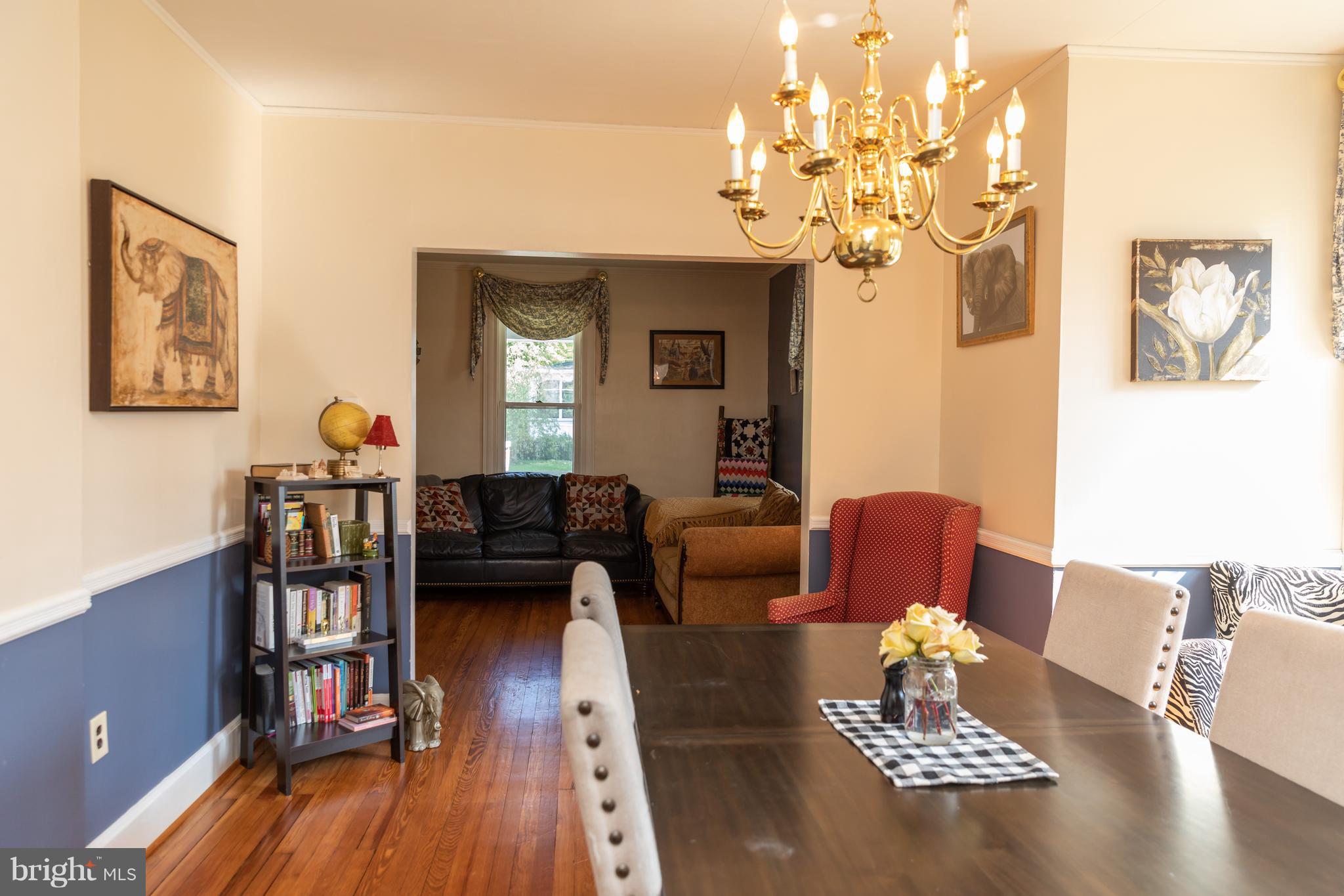 302 South Hammonds Ferry Road Linthicum Heights, MD 21090 - Photo 10 of 29 a living room with fireplace furniture and wooden floor