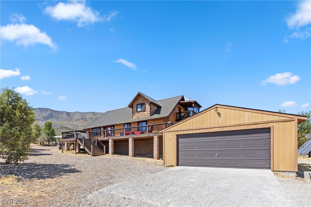 75 Pinon Road Cold Creek, NV 89124 - Photo 4 of 87 Nestled on a .49-acre level corner lot with a 2-car garage.
