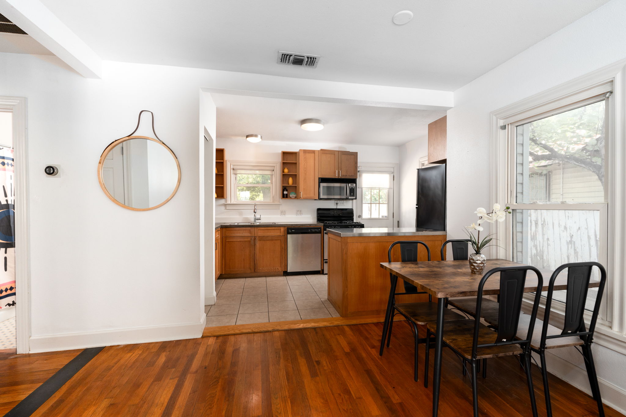 746 Springdale Road Austin, TX 78702 - Photo 7 of 20 The open concept layout effortlessly connects the living room and kitchen, ensuring that entertaining or daily living flows seamlessly