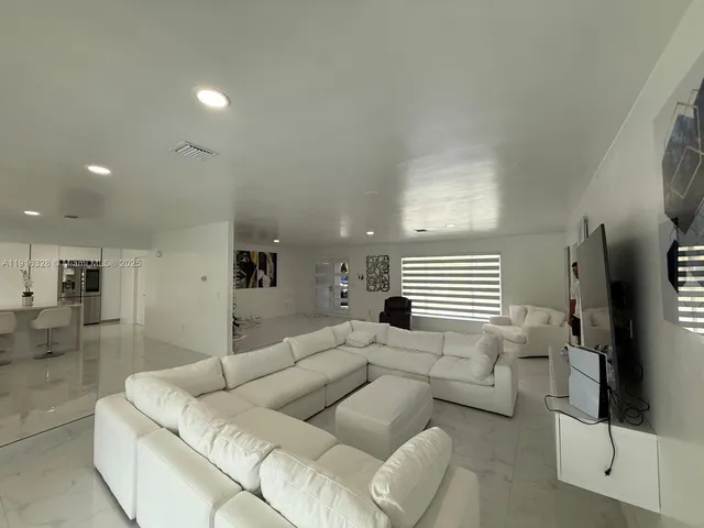 a bedroom with a bed and a ceiling fan