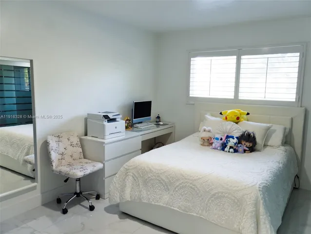 a view of a house with a ocean from a balcony