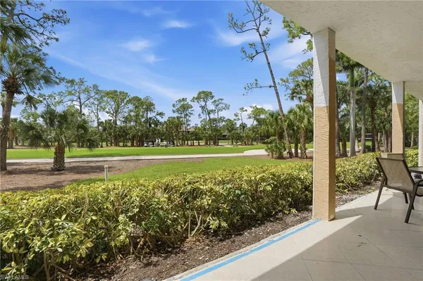 a view of a pathway with a yard