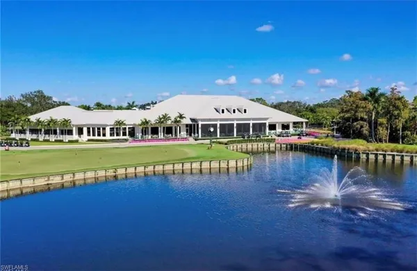 a view of a lake with a house in the background