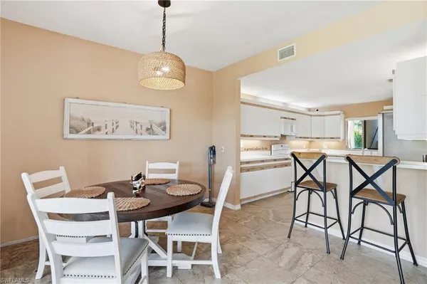 a view of a dining room with furniture