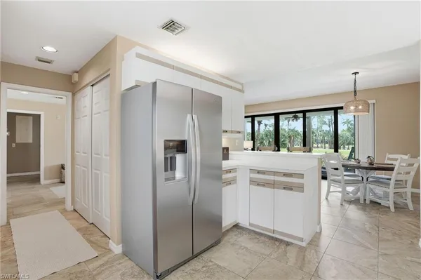 a kitchen with counter top space and appliances