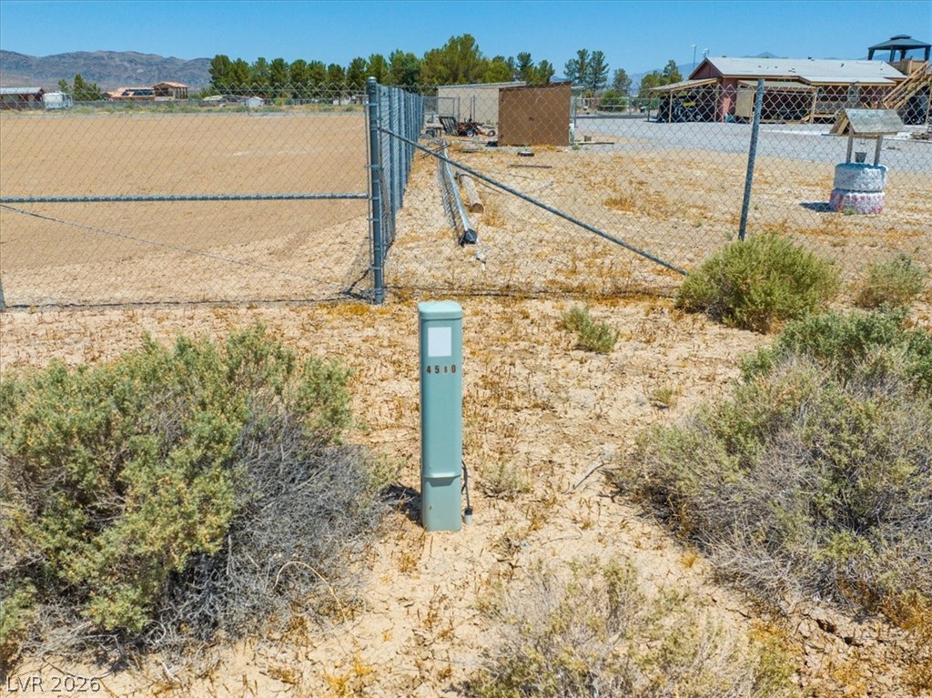 4580 Lawrence Road Pahrump, NV 89048 - Photo 18 of 40 A spacious desert lot awaits your vision, fully fenced for immediate privacy and potential.