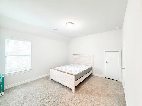 an empty room with a empty space and a window