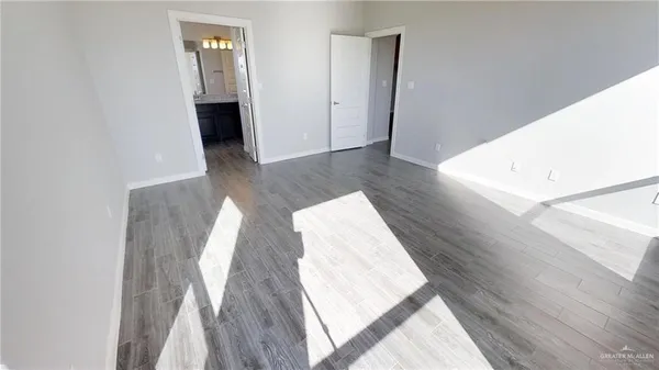a view of wooden floor and staircase in a room
