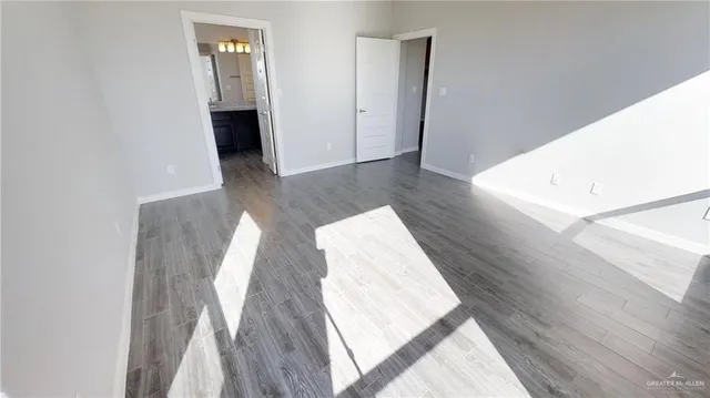 a view of wooden floor and staircase in a room