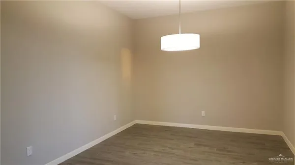 a room with a window and a ceiling fan