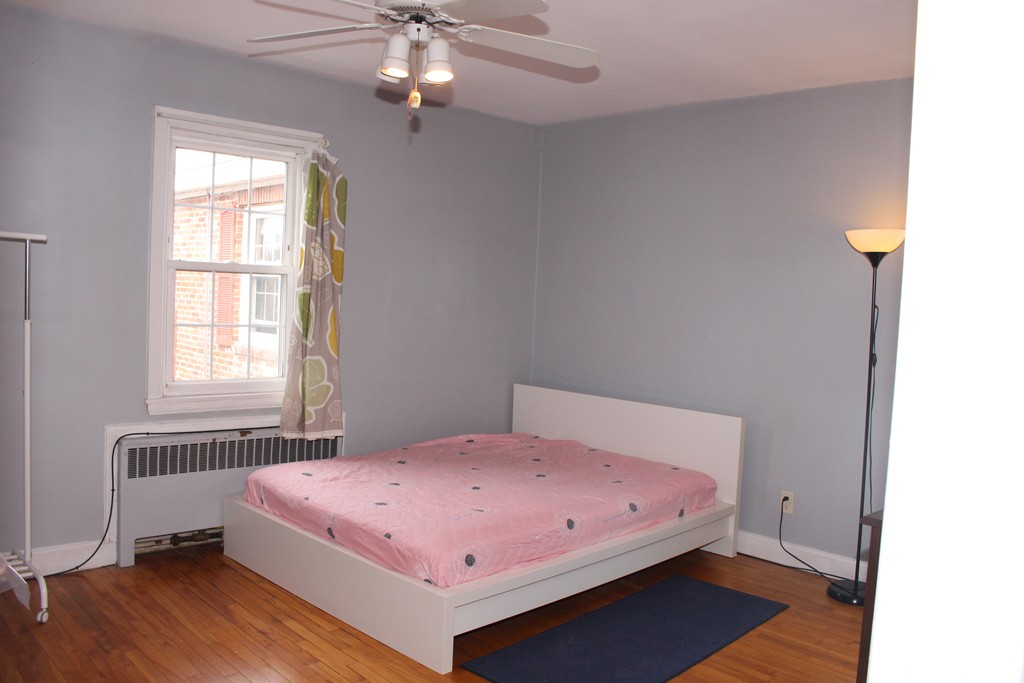 112 Maple Street, Unit 6 Malden, MA 02148 - Photo 5 of 6 a bedroom with a bed and a window