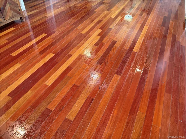 a view of a room with wooden floor and stairs