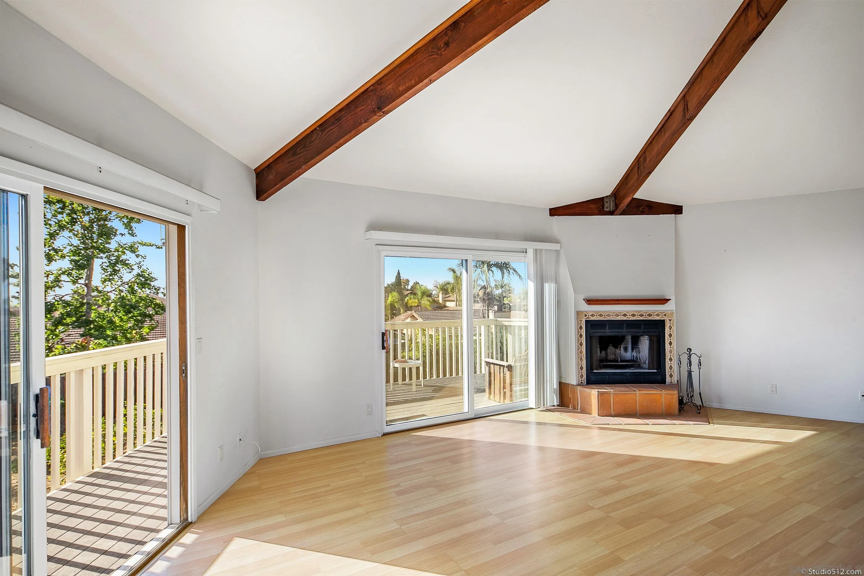 1112 Oceanic Drive Encinitas, CA 92024 - Photo 11 of 32 a view of an empty room with a window and fireplace