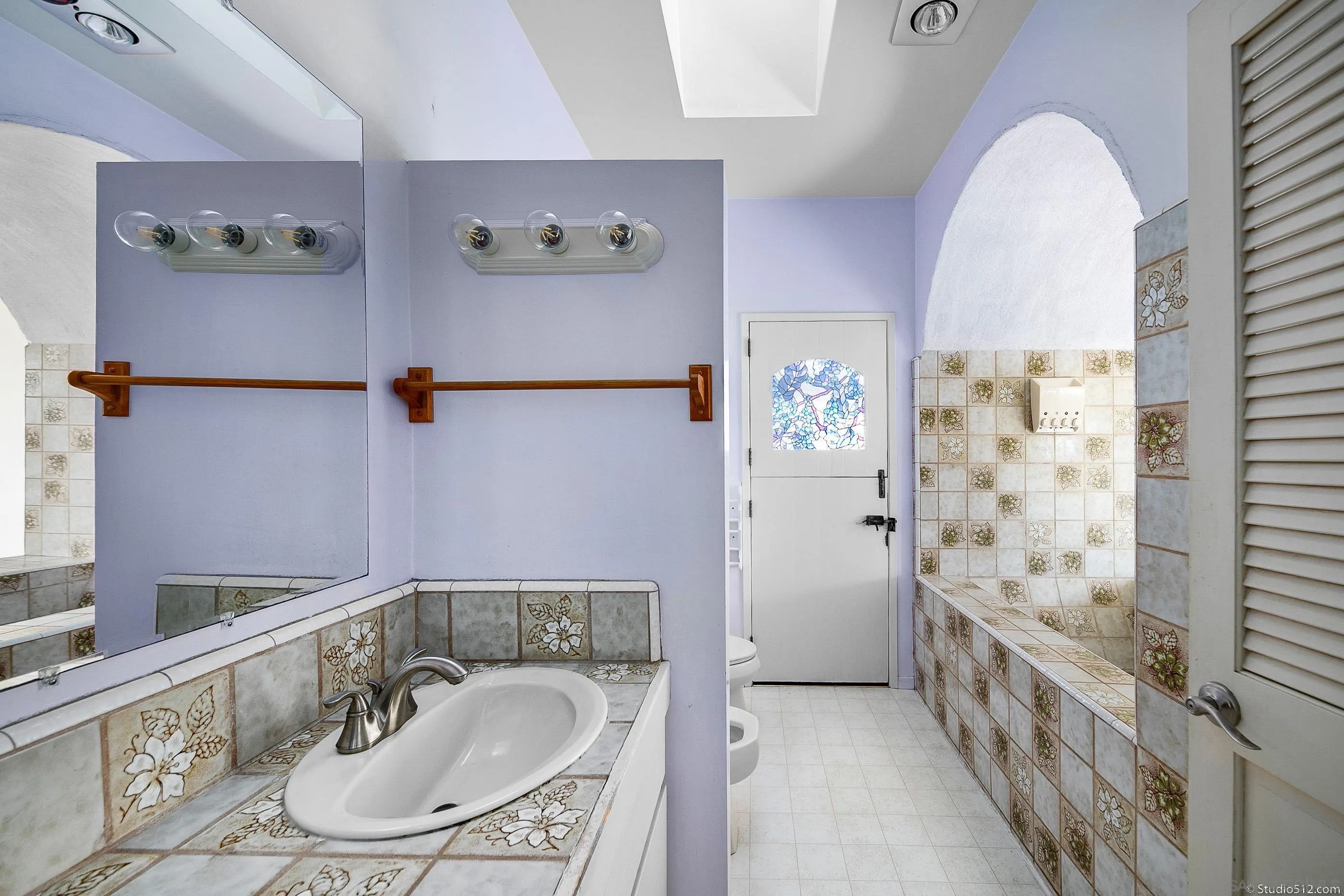 1112 Oceanic Drive Encinitas, CA 92024 - Photo 13 of 32 a bathroom with a sink and a mirror