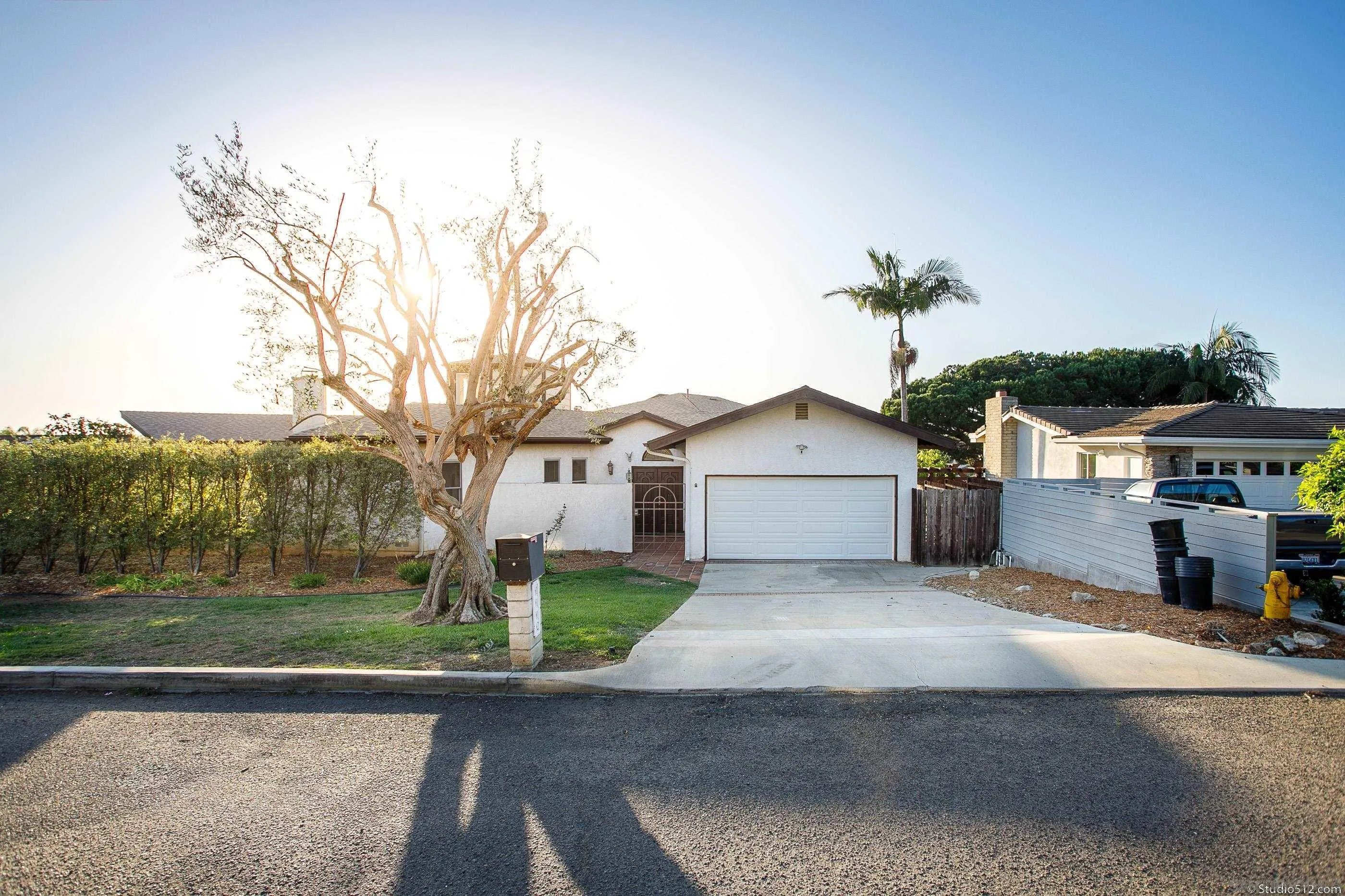 1112 Oceanic Drive Encinitas, CA 92024 - Photo 2 of 32 a front view of a house with a yard and garage