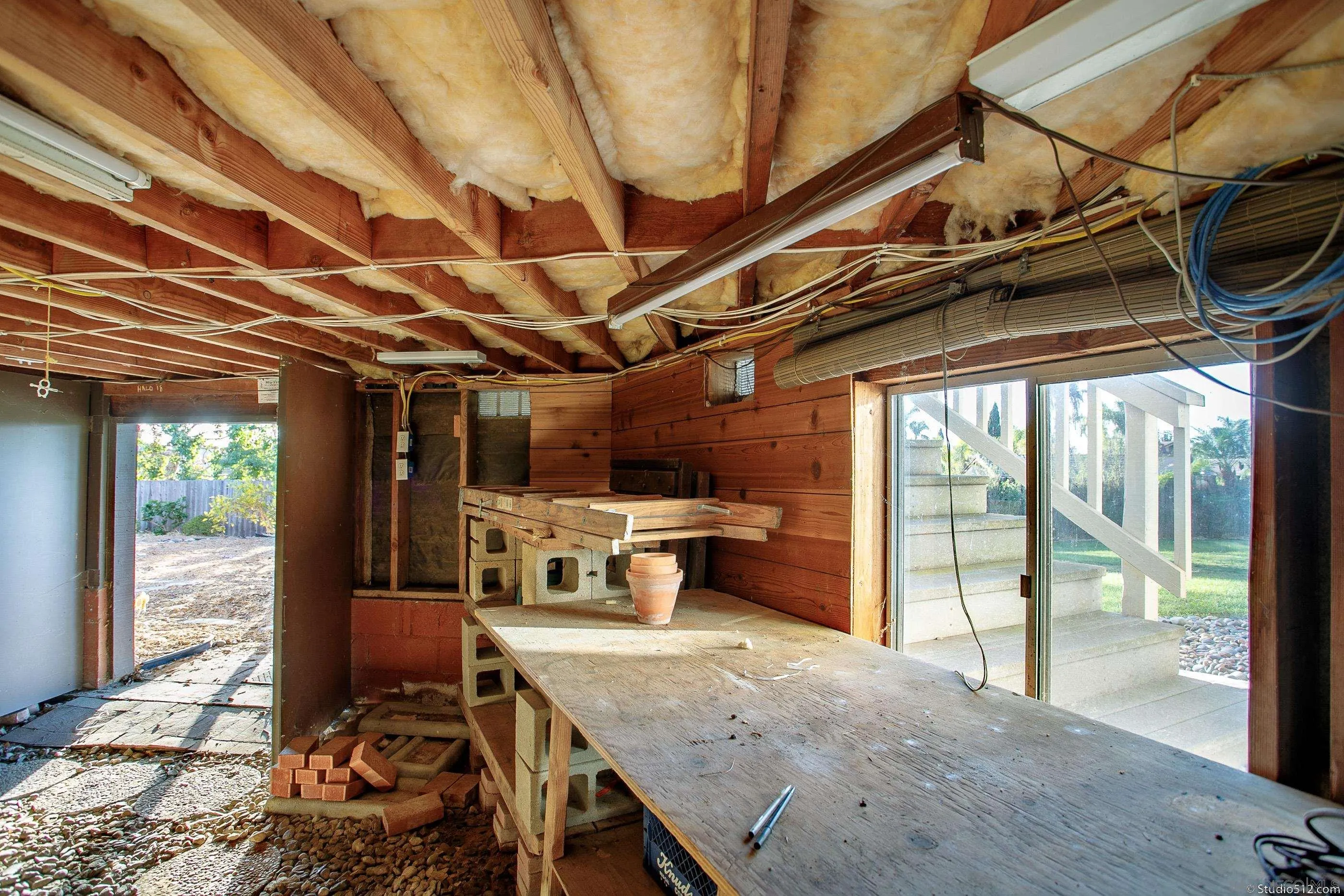 1112 Oceanic Drive Encinitas, CA 92024 - Photo 24 of 32 a view of a kitchen with a sink and wooden floor