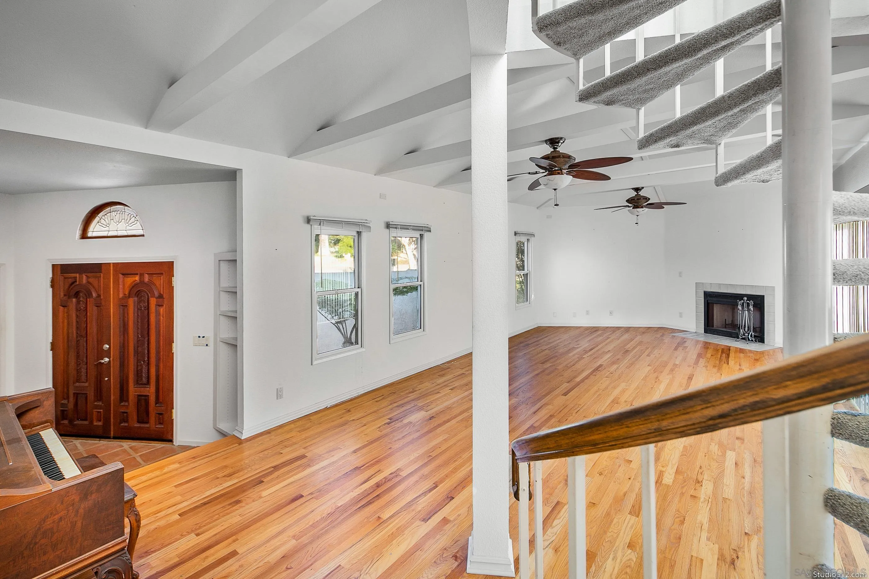 1112 Oceanic Drive Encinitas, CA 92024 - Photo 6 of 32 a bedroom with a bed and a large mirror with a flat tv screen
