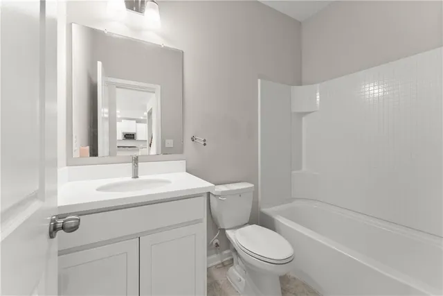 a bathroom with a sink a toilet and a bathtub