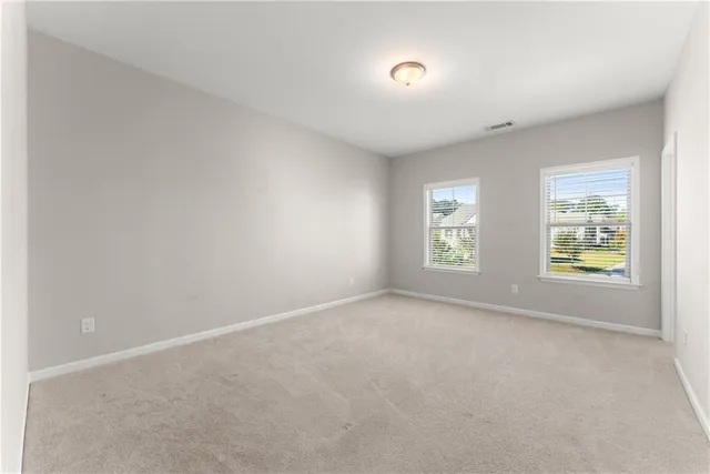 a bathroom with a tub sink toilet and a mirror