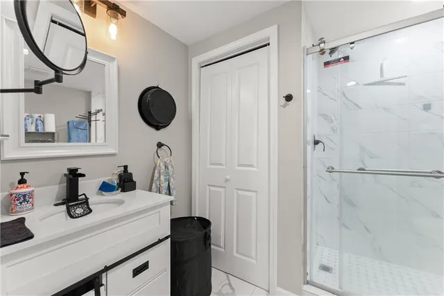 a living room with furniture a flat screen tv and a potted plant