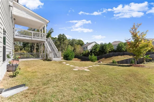 a view of a swimming pool with a yard and mountain view