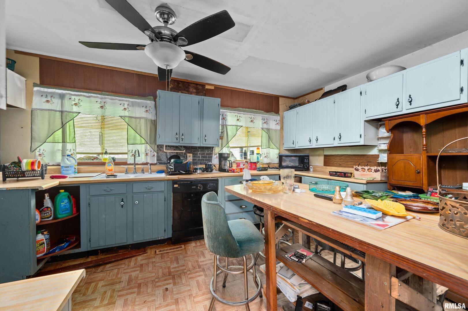 242 South State Avenue Hampton, IL 61256 - Photo 5 of 18 a kitchen with a sink cabinets and window