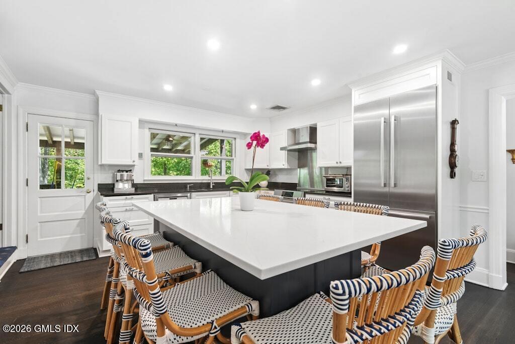 73 Thunder Mountain Road Greenwich, CT 06831 - Photo 7 of 19 a large kitchen with a table and chairs