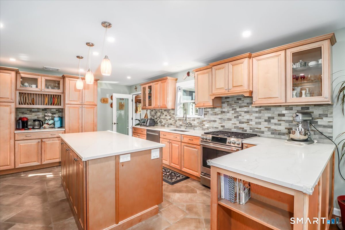 156 Stadley Rough Road Danbury, CT 06811 - Photo 11 of 32 Convenient built in shelves on the end of the peninsula for cookbooks and on the other side of the island is a great nook for a coffee bar