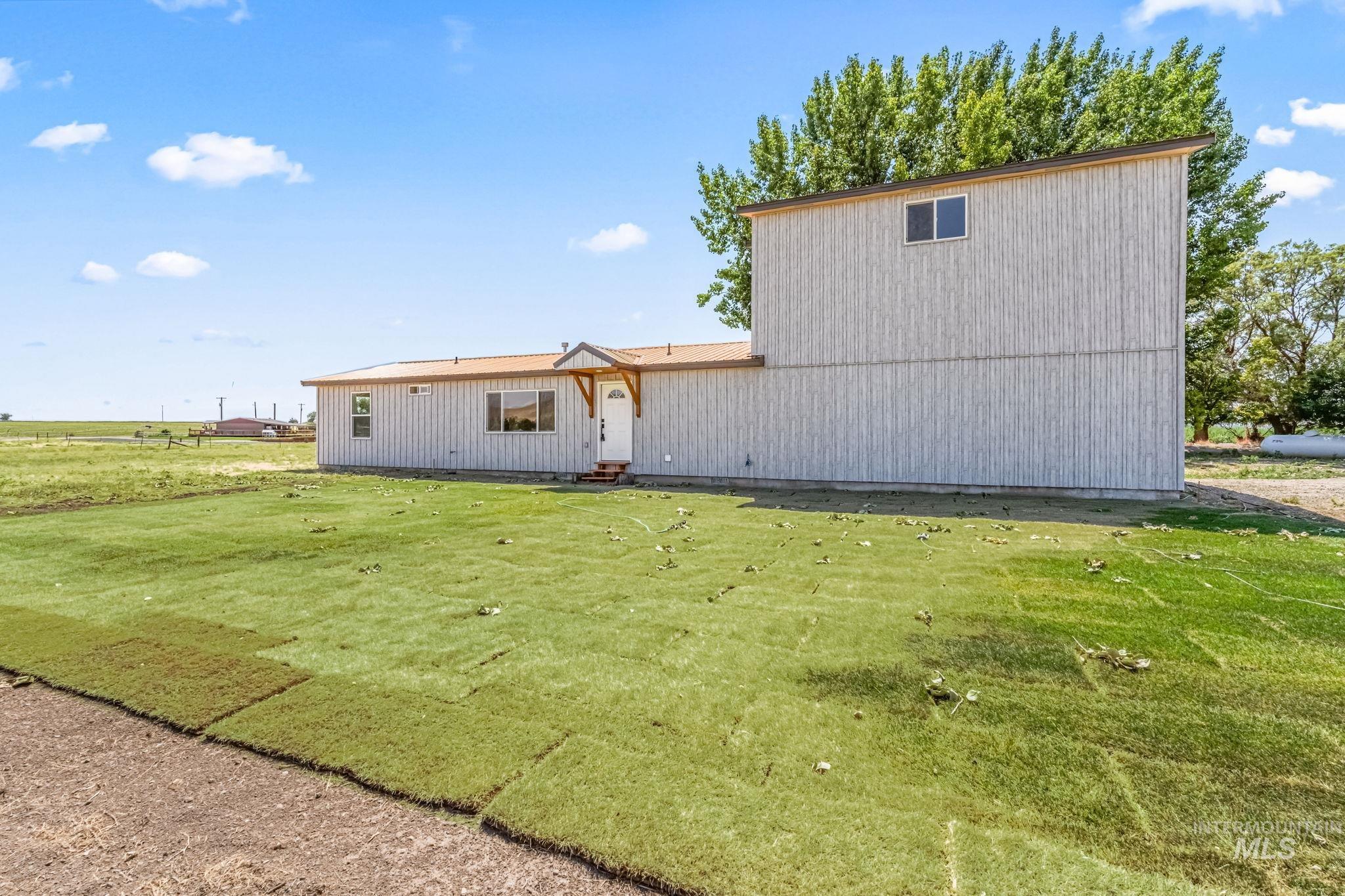 1117 Olds Ferry Road Weiser, ID 83672 - Photo 13 of 36 Rear view of property featuring a lawn