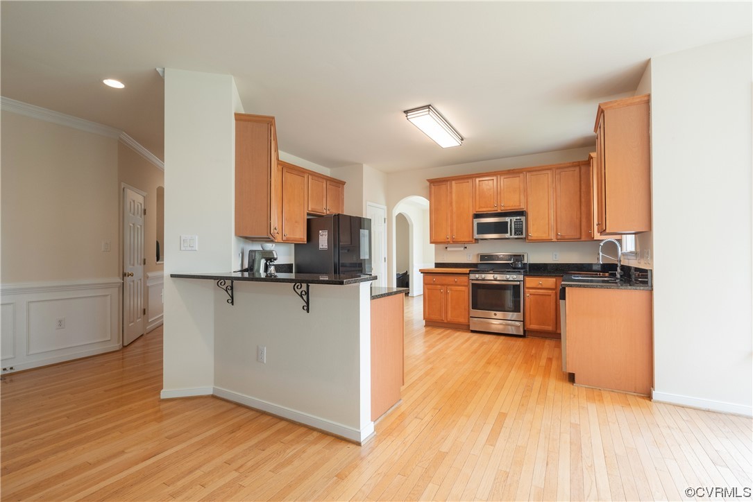 4917 Chappell Ridge Terrace Glen Allen, VA 23059 - Photo 15 of 50 a kitchen with stainless steel appliances a refrigerator and a stove top oven