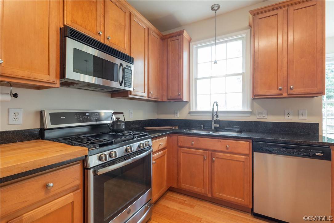 4917 Chappell Ridge Terrace Glen Allen, VA 23059 - Photo 19 of 50 a kitchen with stainless steel appliances granite countertop a sink stove and microwave