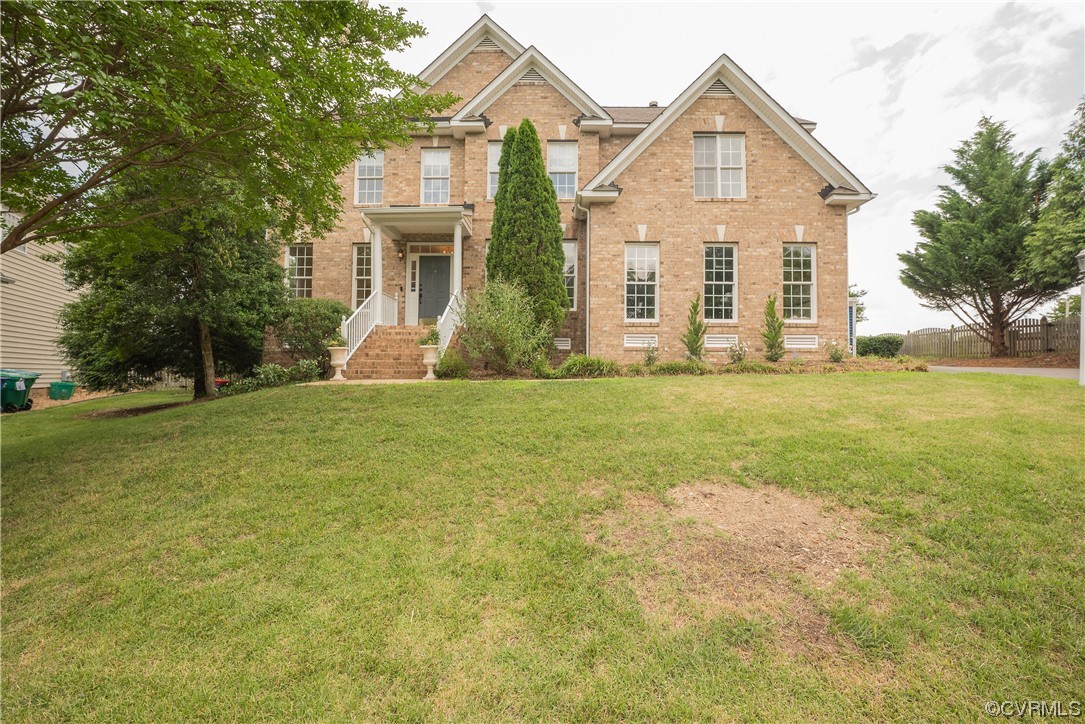 4917 Chappell Ridge Terrace Glen Allen, VA 23059 - Photo 2 of 50 a view of a yard in front of a house with large trees