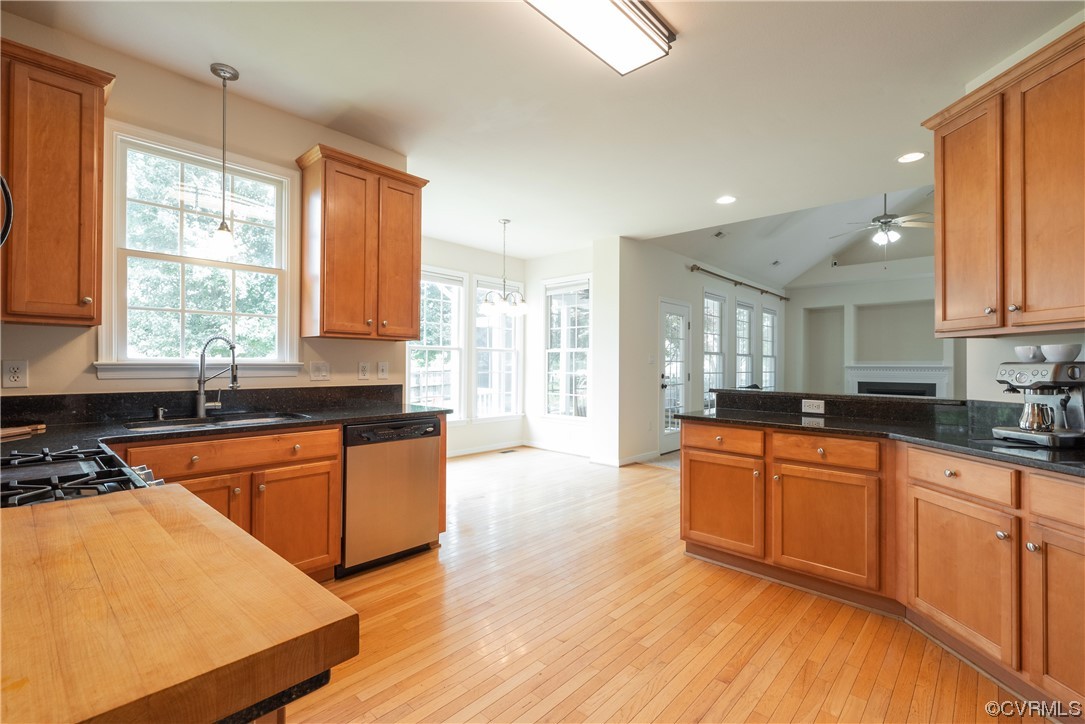 4917 Chappell Ridge Terrace Glen Allen, VA 23059 - Photo 21 of 50 a large kitchen with stainless steel appliances granite countertop wooden cabinets a sink a stove a dining table and chairs